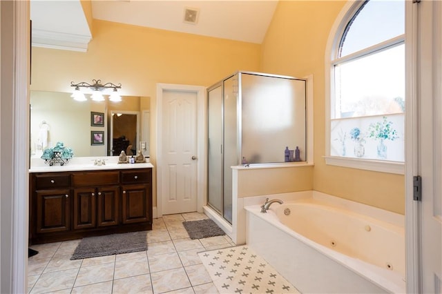 bathroom featuring tile patterned flooring, vanity, lofted ceiling, and shower with separate bathtub