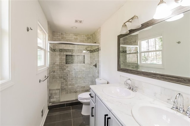 full bath featuring a sink, visible vents, and a stall shower
