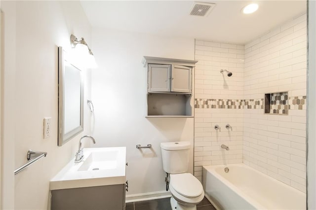 bathroom with visible vents, toilet, shower / bathing tub combination, baseboards, and vanity