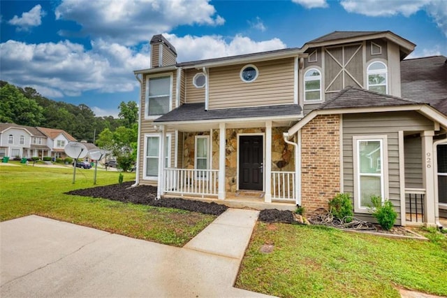 924 Park Gate Pl, Stone Mountain, GA 30083 - townhome / multi-family property with covered porch, a chimney, and a front lawn