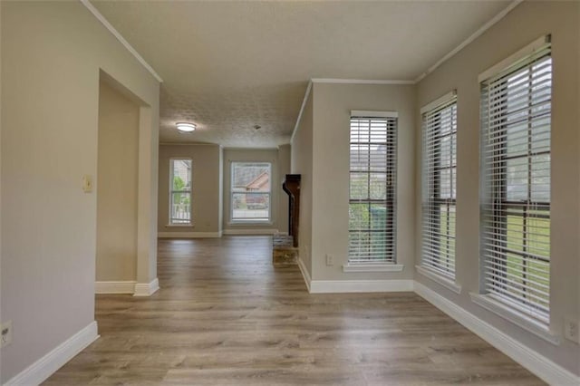 924 Park Gate Pl, Stone Mountain, GA 30083 - hall featuring crown molding, baseboards, wood finished floors, and a textured ceiling
