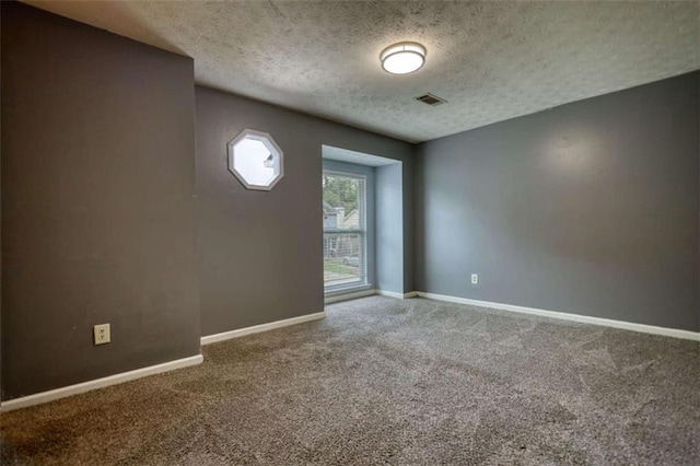 924 Park Gate Pl, Stone Mountain, GA 30083 - unfurnished room with carpet, a textured ceiling, and baseboards