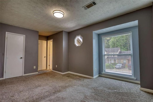 924 Park Gate Pl, Stone Mountain, GA 30083 - carpeted spare room featuring healthy amount of natural light, baseboards, and a textured ceiling