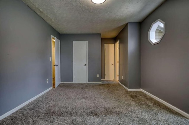 924 Park Gate Pl, Stone Mountain, GA 30083 - unfurnished bedroom with a textured ceiling, carpet, and baseboards