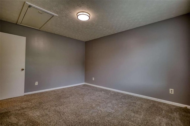 924 Park Gate Pl, Stone Mountain, GA 30083 - empty room with carpet floors, attic access, a textured ceiling, and baseboards