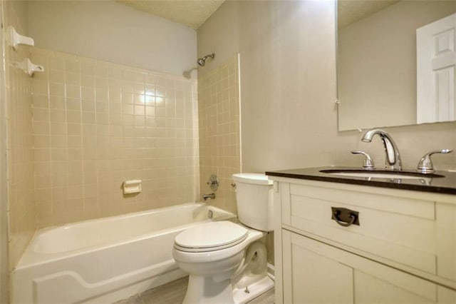 924 Park Gate Pl, Stone Mountain, GA 30083 - bathroom featuring toilet, vanity, shower / bathtub combination, and a textured ceiling