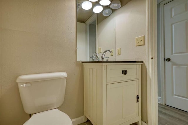 924 Park Gate Pl, Stone Mountain, GA 30083 - half bath with toilet, vanity, and wood finished floors