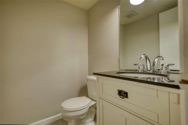 924 Park Gate Pl, Stone Mountain, GA 30083 - bathroom featuring toilet, vanity, tile patterned flooring, and baseboards