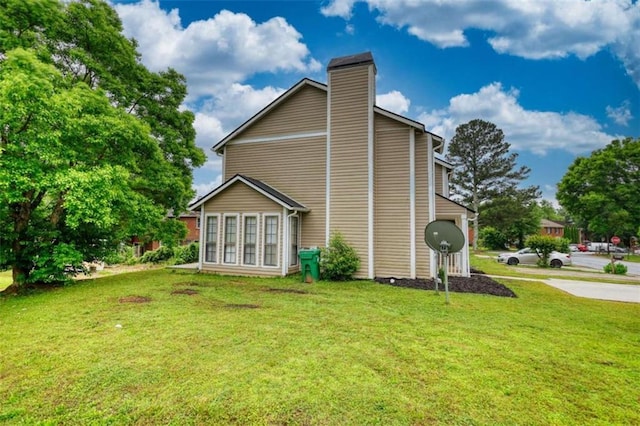 924 Park Gate Pl, Stone Mountain, GA 30083 - view of property exterior featuring a chimney and a lawn