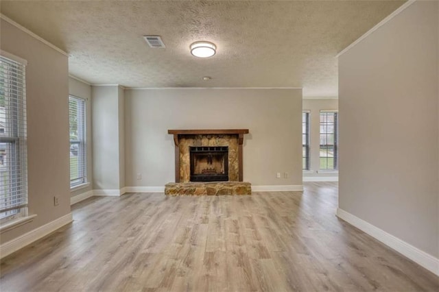 924 Park Gate Pl, Stone Mountain, GA 30083 - unfurnished living room featuring wood finished floors, ornamental molding, baseboards, a fireplace, and a textured ceiling