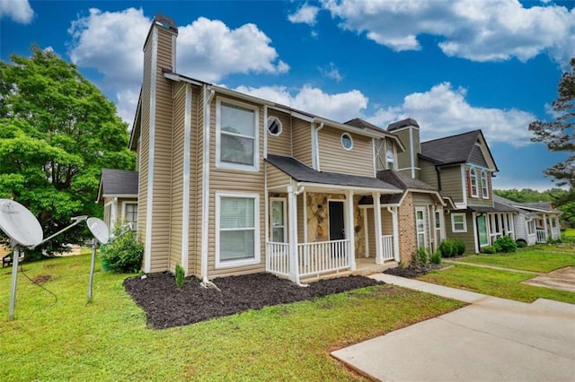924 Park Gate Pl, Stone Mountain, GA 30083 - view of front facade with a chimney, a porch, and a front lawn