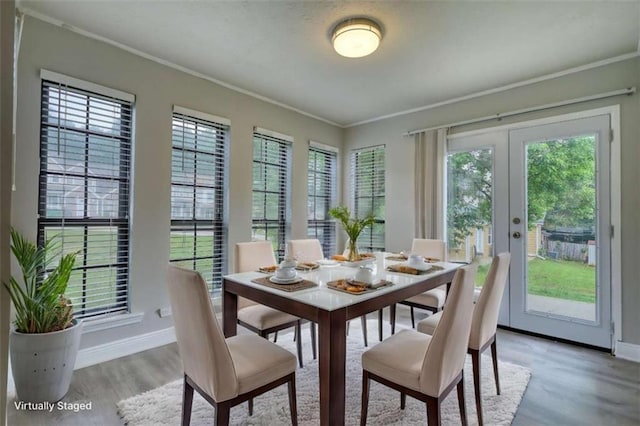 924 Park Gate Pl, Stone Mountain, GA 30083 - dining area featuring french doors, ornamental molding, light wood-style flooring, plenty of natural light, and baseboards