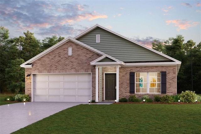 view of front of house featuring a front yard, an attached garage, brick siding, and driveway