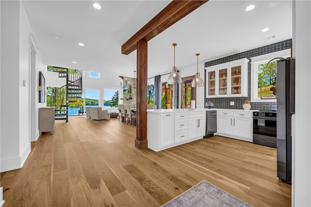 1132 N Edgewater Trl, Toccoa, GA 30577 - kitchen featuring electric range, dishwashing machine, open floor plan, glass insert cabinets, and beamed ceiling