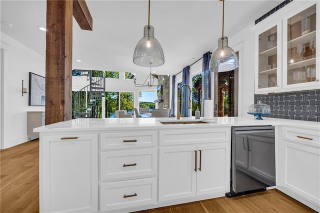 1132 N Edgewater Trl, Toccoa, GA 30577 - kitchen with dishwasher, light countertops, decorative backsplash, glass insert cabinets, and white cabinetry