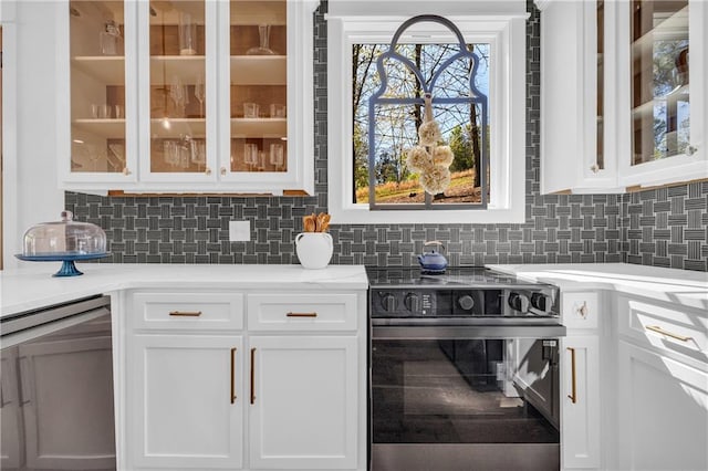 1132 N Edgewater Trl, Toccoa, GA 30577 - kitchen with stainless steel appliances, white cabinetry, decorative backsplash, and glass insert cabinets