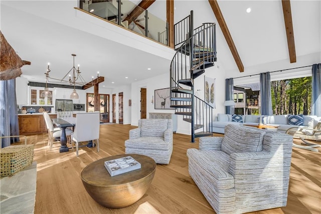 1132 N Edgewater Trl, Toccoa, GA 30577 - living room with high vaulted ceiling, a chandelier, stairs, light wood-style flooring, and beamed ceiling