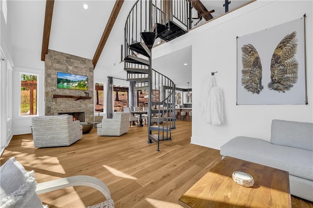 1132 N Edgewater Trl, Toccoa, GA 30577 - living room with stairway, high vaulted ceiling, beamed ceiling, wood finished floors, and a fireplace