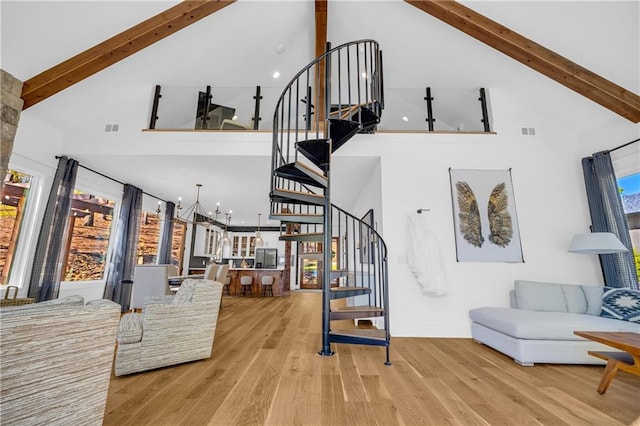 1132 N Edgewater Trl, Toccoa, GA 30577 - stairway featuring high vaulted ceiling, beam ceiling, wood finished floors, and healthy amount of natural light