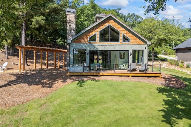 1132 N Edgewater Trl, Toccoa, GA 30577 - back of house featuring a chimney, a deck, and a lawn