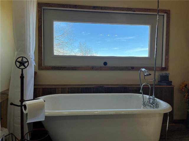 full bath featuring a freestanding bath