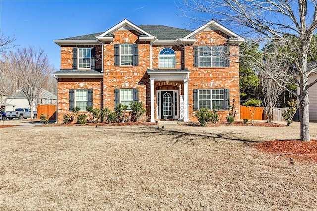 front facade featuring a front lawn