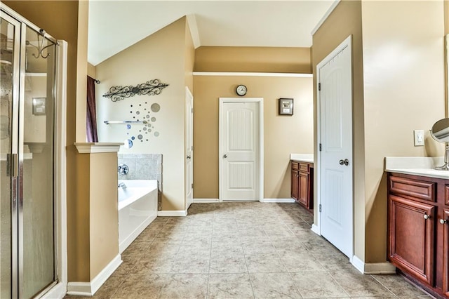 bathroom featuring vanity, shower with separate bathtub, and tile patterned floors