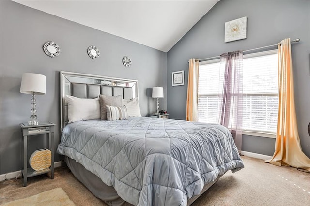 bedroom with light carpet and vaulted ceiling