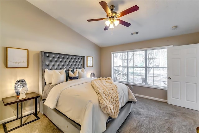 carpeted bedroom featuring a ceiling fan, lofted ceiling, visible vents, and baseboards