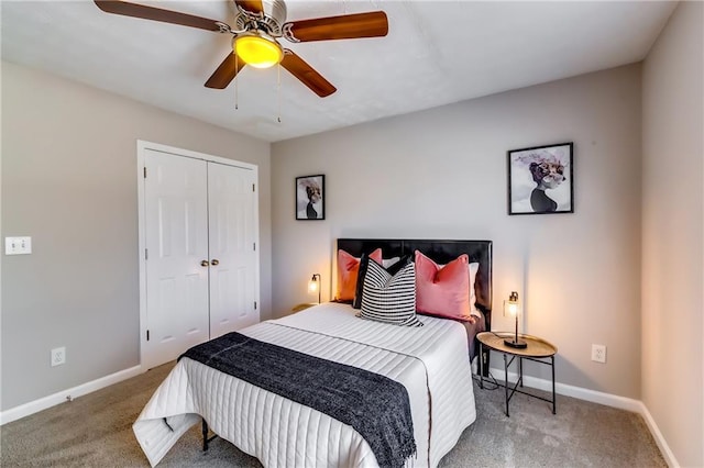 bedroom with a closet, carpet flooring, and baseboards