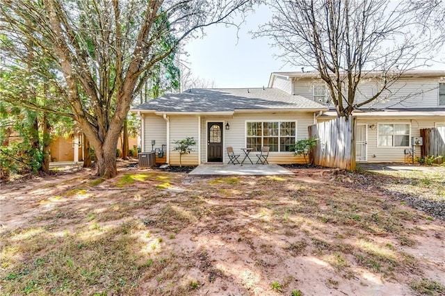 rear view of property featuring cooling unit and a patio area