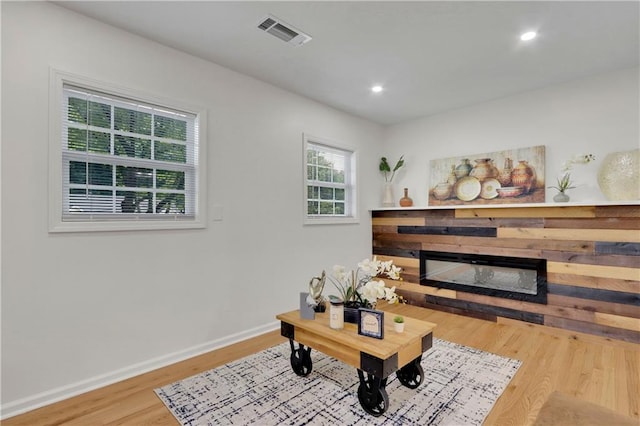 6914 Fairway Trl, Austell, GA 30168 - living area featuring recessed lighting, baseboards, visible vents, a glass covered fireplace, and wood finished floors