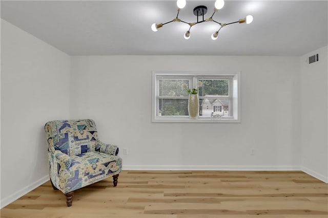6914 Fairway Trl, Austell, GA 30168 - sitting room featuring baseboards, visible vents, a chandelier, and wood finished floors