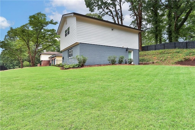 6914 Fairway Trl, Austell, GA 30168 - view of side of home with brick siding, fence, and a yard