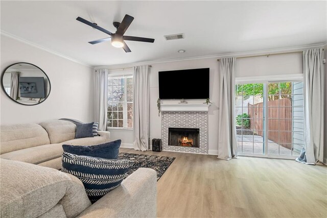 3088 Steeplechase Dr, Alpharetta, GA 30004 - living area featuring ceiling fan, visible vents, a fireplace, wood finished floors, and ornamental molding