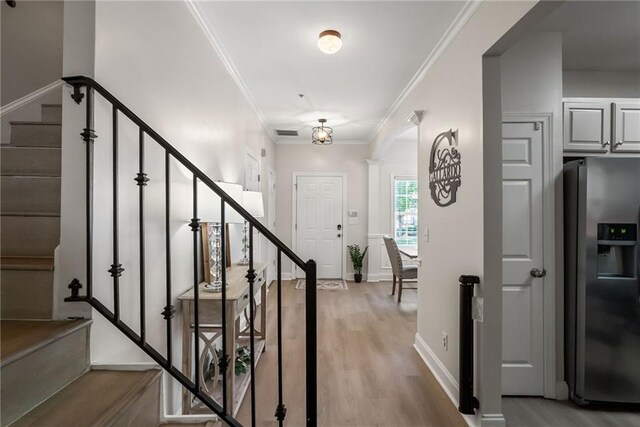 3088 Steeplechase Dr, Alpharetta, GA 30004 - stairs with baseboards, ornamental molding, and wood finished floors