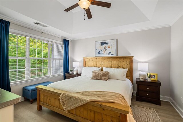 3088 Steeplechase Dr, Alpharetta, GA 30004 - bedroom with a tray ceiling, visible vents, multiple windows, and wood finished floors