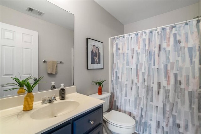 3088 Steeplechase Dr, Alpharetta, GA 30004 - bathroom featuring visible vents, curtained shower, toilet, and vanity