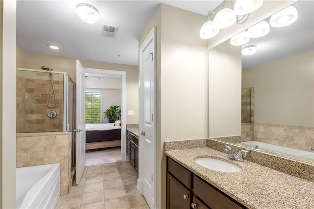 200 River Vista Dr Unit 426, Atlanta, GA 30339 - full bathroom with tile patterned flooring, ensuite bathroom, vanity, visible vents, and a stall shower