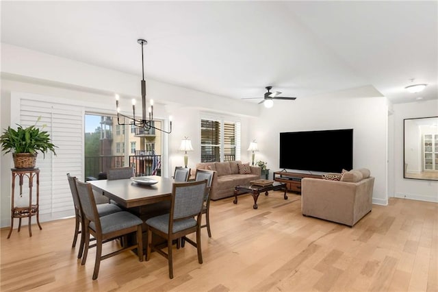 200 River Vista Dr Unit 426, Atlanta, GA 30339 - dining area featuring light wood-type flooring and ceiling fan with notable chandelier