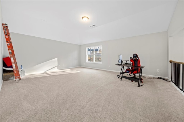 exercise room with light colored carpet