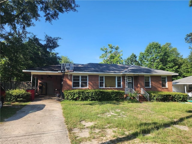 single story home featuring a front yard and a carport