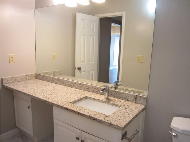 4018 Woodridge Way, Tucker, GA 30084 - half bath featuring vanity, toilet, and marble finish floor