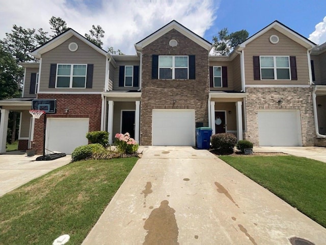 view of front of property featuring a garage and a front yard