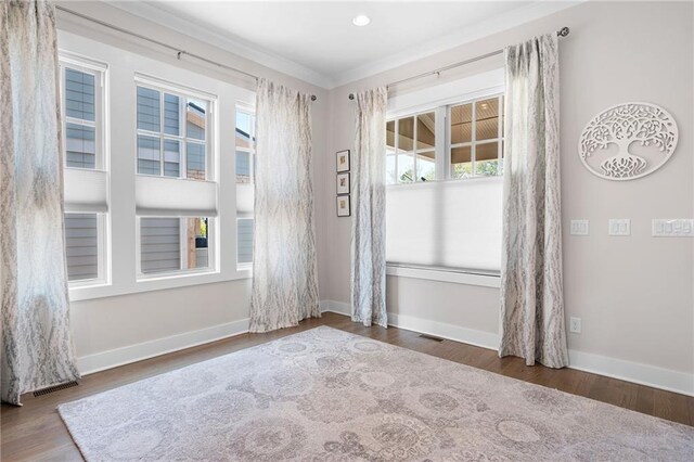 168 Brighton Blvd, Woodstock, GA 30188 - unfurnished room featuring crown molding, baseboards, wood finished floors, and recessed lighting