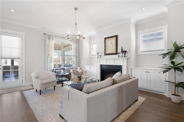 168 Brighton Blvd, Woodstock, GA 30188 - living area featuring a glass covered fireplace, a chandelier, wood finished floors, recessed lighting, and ornamental molding