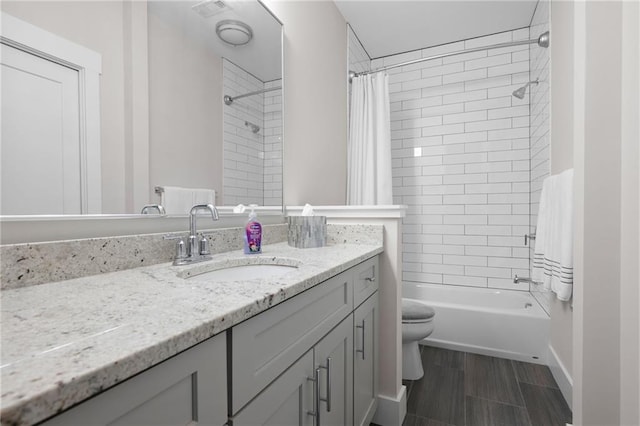 168 Brighton Blvd, Woodstock, GA 30188 - bathroom with vanity, toilet, shower / bathtub combination with curtain, and wood finished floors