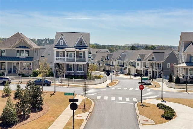 168 Brighton Blvd, Woodstock, GA 30188 - view of asphalt road featuring traffic signs, sidewalks, and a residential view
