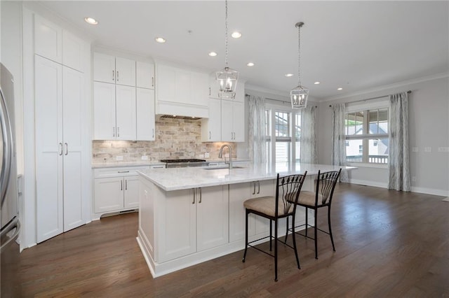 168 Brighton Blvd, Woodstock, GA 30188 - kitchen with dark wood-style flooring, crown molding, recessed lighting, white cabinetry, and a sink