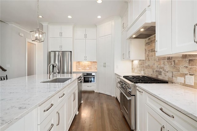 168 Brighton Blvd, Woodstock, GA 30188 - kitchen featuring appliances with stainless steel finishes, a sink, custom range hood, recessed lighting, and white cabinets